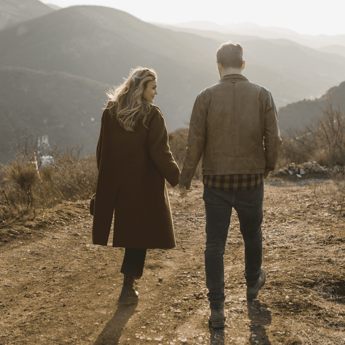 hand holding couple.