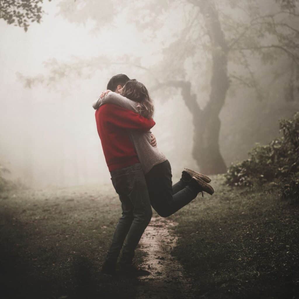 couple hugging rain